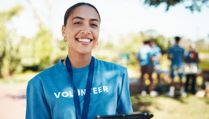 Woman, happy and portrait of volunteer in nature with community service, NGO or donation project. Smile, confident and female charity worker with confidence outdoor in field for social activism. Woman, happy and portrait of volunteer in nature with community service, NGO or donation project. Smile, confident and female charity worker with confidence outdoor in field for social activism.